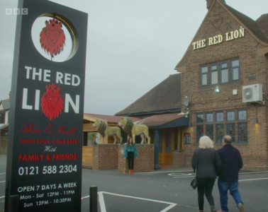 A screengrab from the BBC show 'Back in Time for Birmingham' showing two people walking towards the Red Lion pub in West Bromwich.