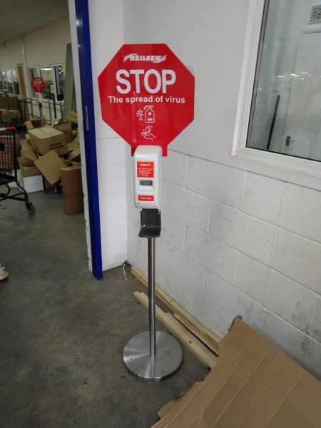 STOP sign with hand sanitiser dispenser