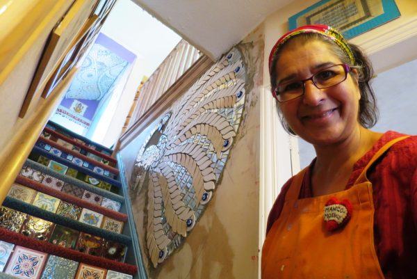 Mosaic artist Caroline Jariwala at home in Bearwood with mosaics on the wall and stairs