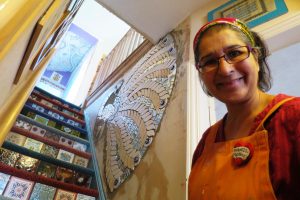 Mosaic artist Caroline Jariwala at home in Bearwood with mosaics on the wall and stairs