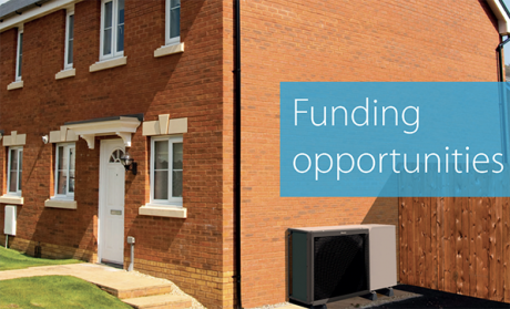 Close up of modern terraced houses with text "Funding opportunities"