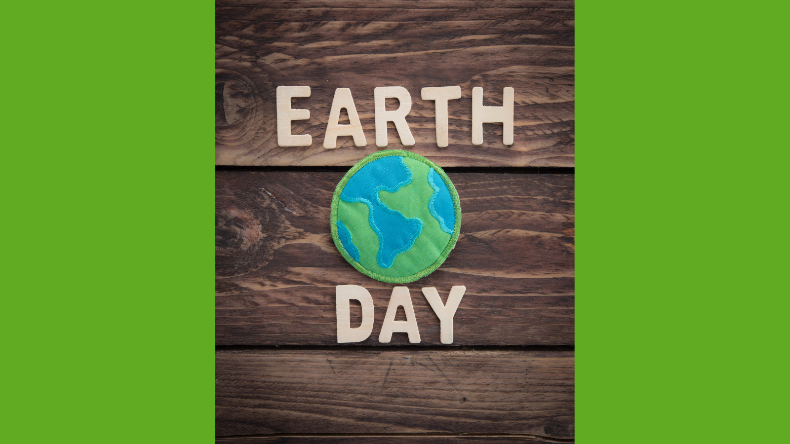 Banner for Earth Day with a cut out fabric globe pinned to a fence