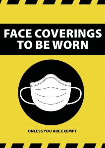 Face Coverings To Be Worn sign in yellow and black