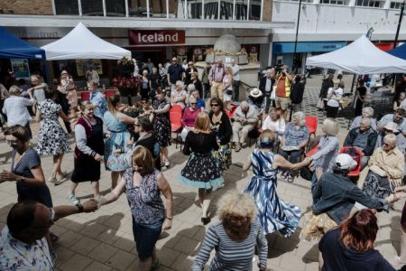 People dancing in the street outside Iceland shop