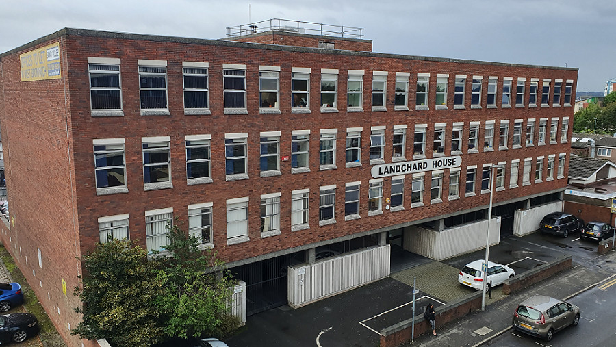 Lanchard House office building with cars parked out front