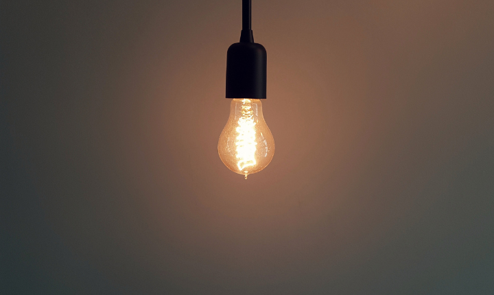 Lone lightbulb hanging from ceiling