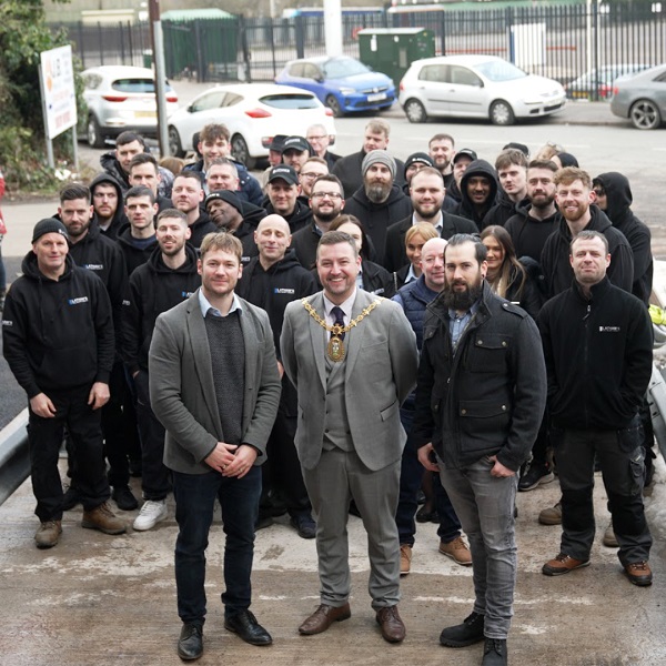 Staff of Latham's celebrate the Sandwell door company's success, with Mayor of Sandwell