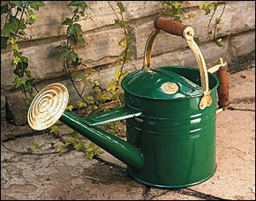 A green metal Haws watering can