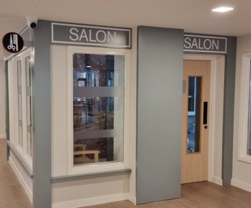 A photograph of a retail unit with the word 'salon' over the door and window