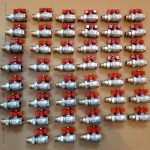 Neatly lined up valves in silver and red