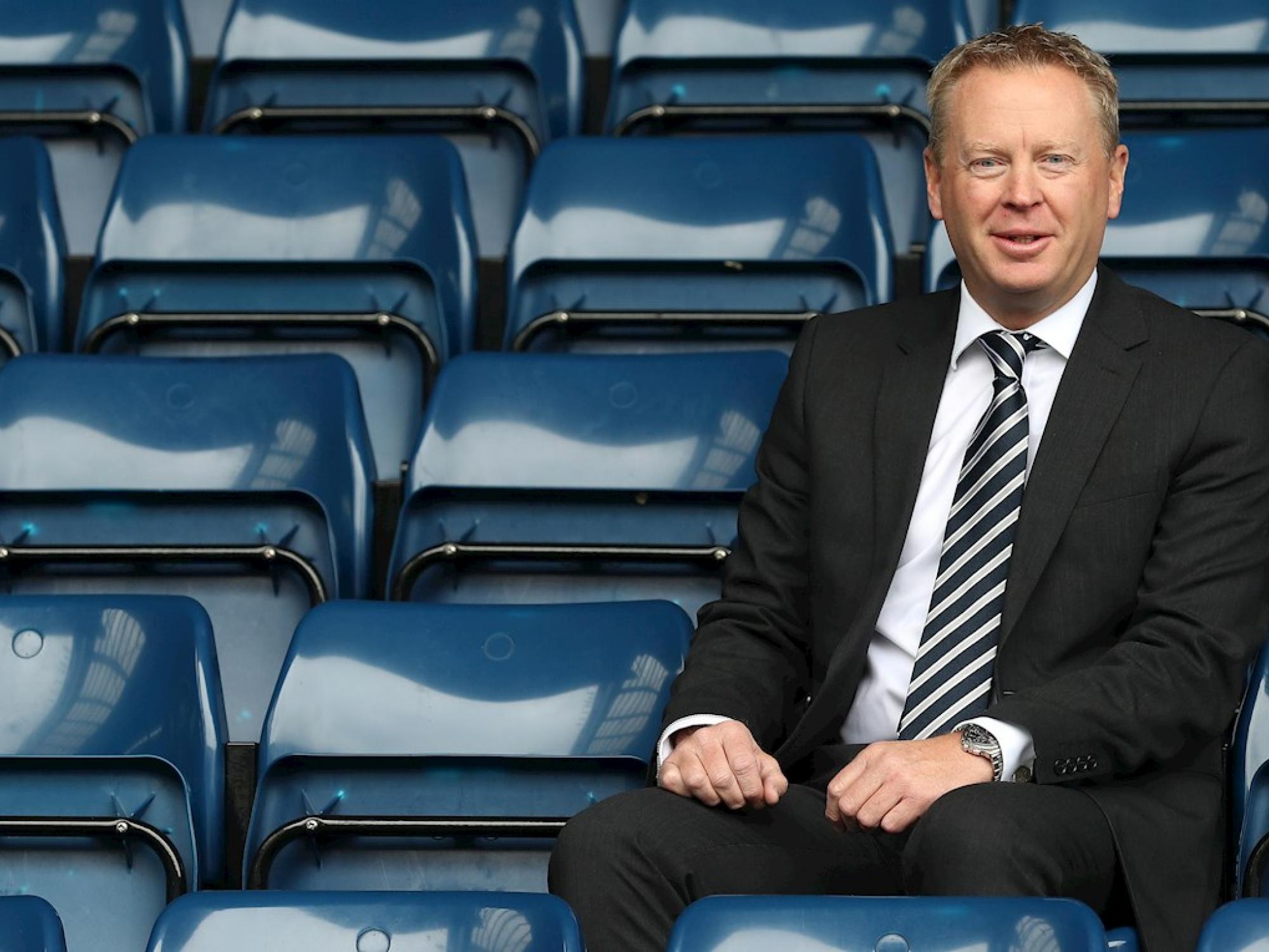 The chief executive of West Bromwich Albion, Mark Jenkins, sitting in the stands