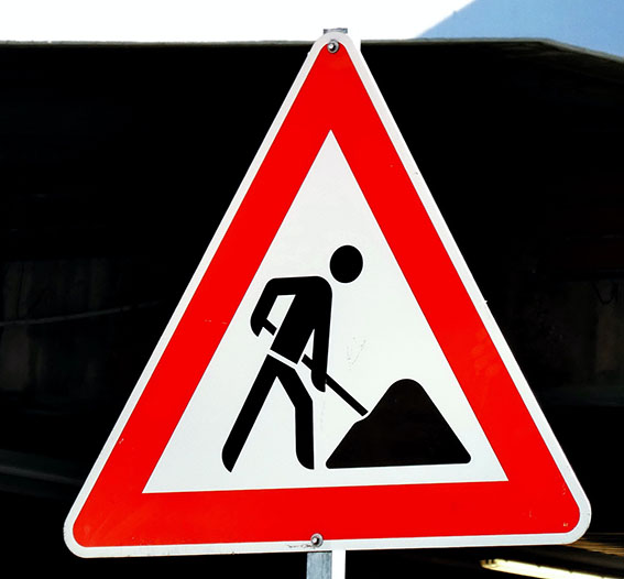Triangular road works sign